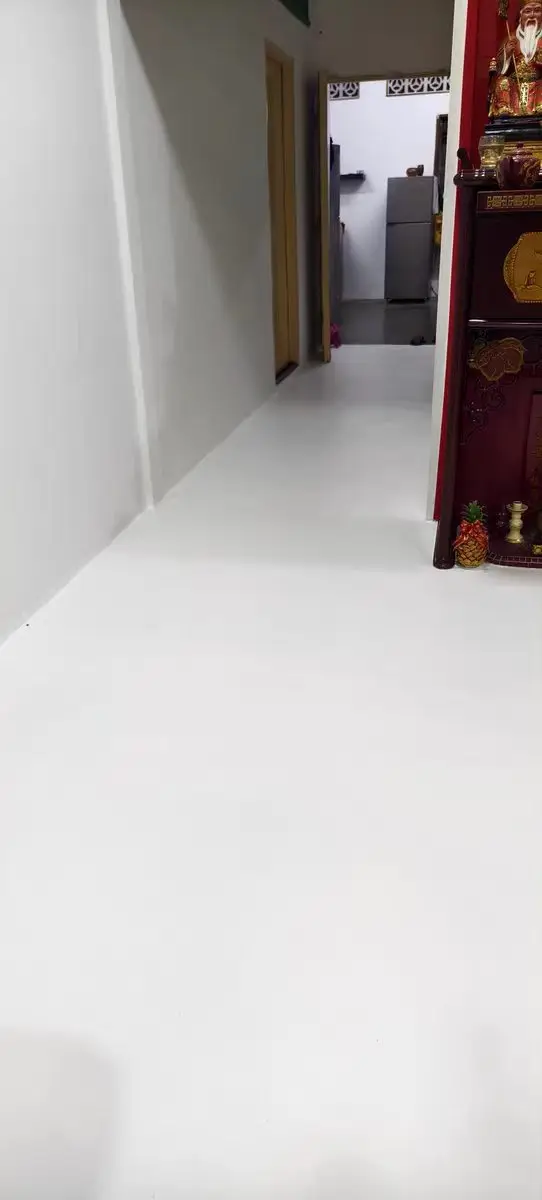 Completed light-colored residential floor and corridor surface.