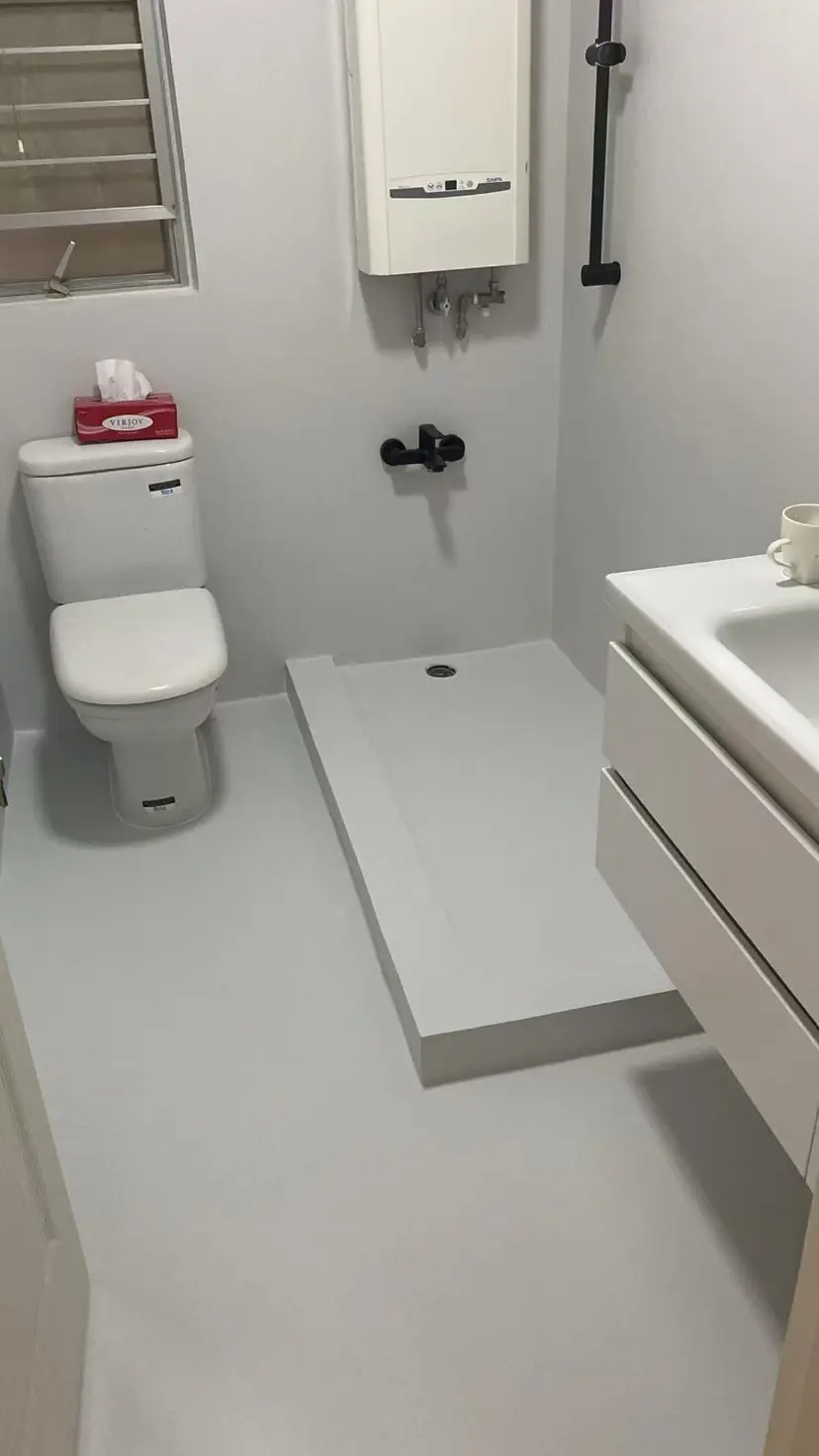 Completed bathroom floor and wall surfaces.