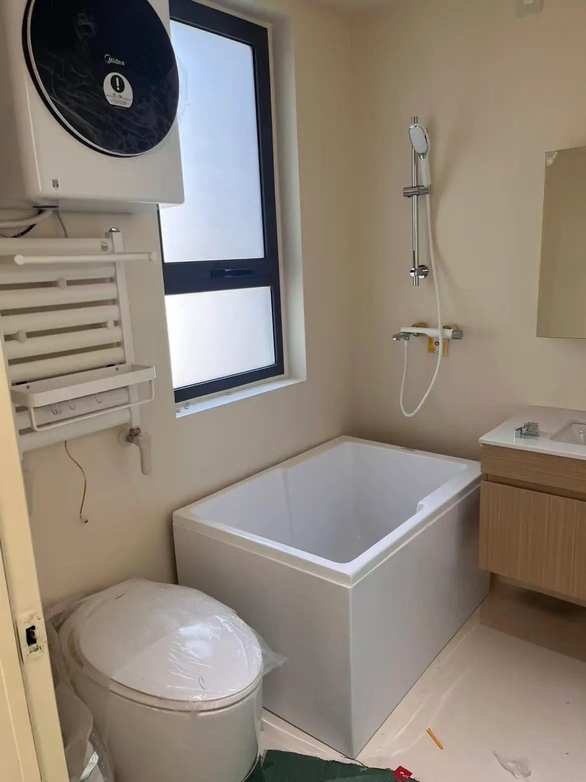 Completed bathroom renovation with bathtub.