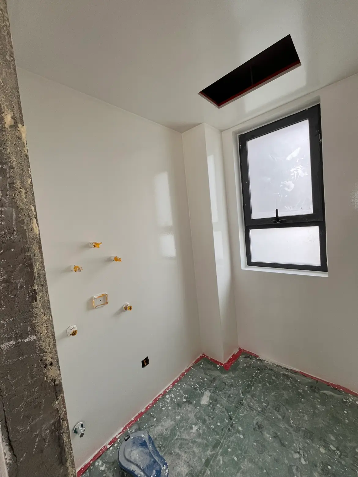 Interior wall coating application area before completion.